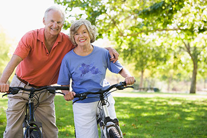 Photo of a man and woman on bicycles.